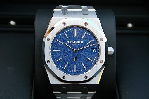 IMG_6368 | SD Watches Close-up of a stainless steel Audemars Piguet Royal Oak watch with a blue textured dial, date window at 3, and hex screws on the bezel.
