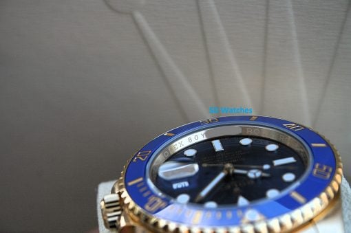 IMG_6486 | SD Watches Close-up of a blue and gold Rolex-style watch with a blue bezel and visible dial details.