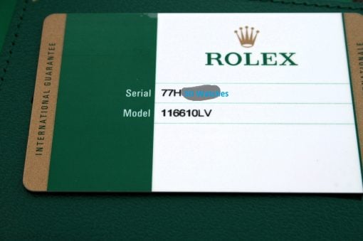 IMG_6551 | SD Watches Rolex warranty card showing model 116610LV and serial partially obscured, with green and white branding in a wallet.