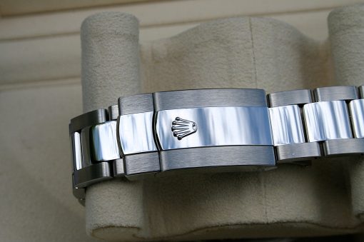 IMG_6699 | SD Watches Close-up of a silver stainless steel Rolex watch bracelet clasp displaying the Rolex crown logo