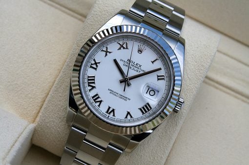 IMG_6726 | SD Watches Close-up of a Rolex Datejust stainless steel watch with white dial, Roman numerals, fluted bezel, and date at 3.