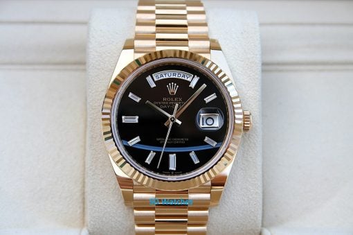 Rolex 228238 | SD Watches Gold Rolex Day-Date watch with black dial, diamond markers, and day/date windows.