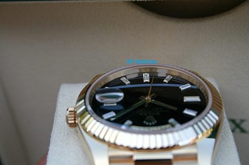 IMG_6737 | SD Watches Close-up of a gold-and-silver Rolex wristwatch with diamond hour markers resting on a soft surface, watermarked with 'SD Watches' in blue.