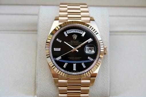 IMG_6744 | SD Watches Gold Rolex Day-Date wristwatch with black dial, gold bezel, and link bracelet showing the day at the top and date magnifier.