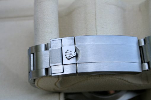 IMG_6780 | SD Watches Close-up of a stainless steel Rolex watch bracelet clasp with the crown logo on the clasp surface
