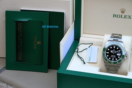 IMG_6788 | SD Watches Rolex watch in a green presentation box with accompanying tags and booklet visible inside the box shelf edge