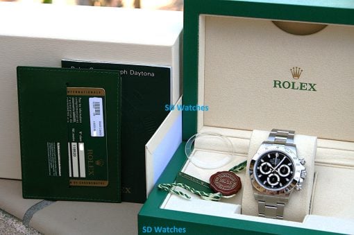 IMG_6835 | SD Watches Rolex Daytona watch in an open green presentation box with beige interior and accompanying warranty papers.