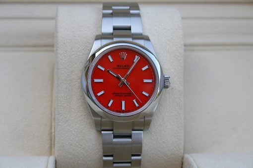 IMG_6773 | SD Watches Rolex Oyster Perpetual stainless steel watch with a bright red dial on a beige display pillow.
