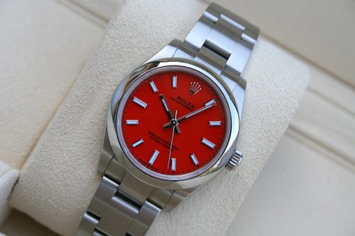 IMG_6774 | SD Watches Rolex Oyster Perpetual stainless steel watch with bright red dial on a beige cushion