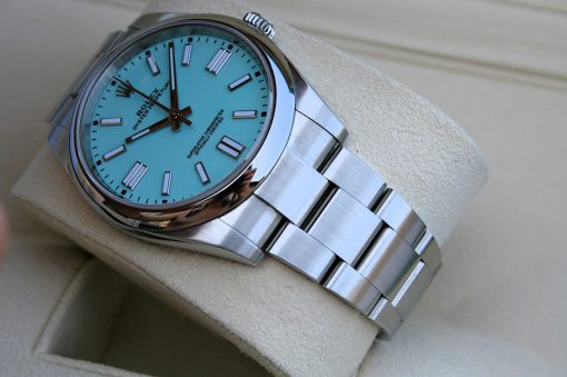 IMG_6800 | SD Watches Turquoise-dial Rolex Oyster Perpetual wristwatch resting on a beige cushion in a display box