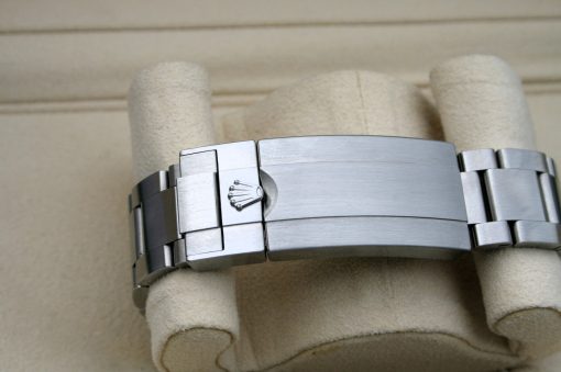 IMG_7076 | SD Watches Close-up of a stainless steel Rolex watch bracelet with the Rolex crown logo on the clasp.