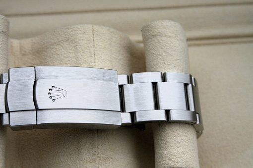 IMG_7109 | SD Watches Close-up of a brushed stainless steel watch bracelet with a Rolex crown logo on the clasp.