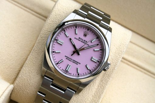 IMG_7121 | SD Watches Rolex Oyster Perpetual wristwatch with a pink dial and stainless steel bracelet on a beige surface