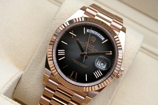 IMG_7159 | SD Watches Rose gold Rolex Day-Date watch with black dial, day and date windows, resting on a beige cushion.