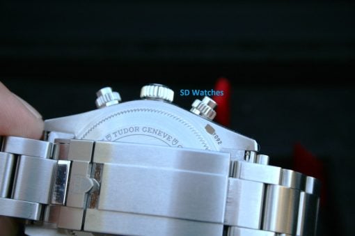 IMG_7198 | SD Watches Close-up of a stainless steel watch case and bracelet with knurled crowns; SD Watches text overlay.