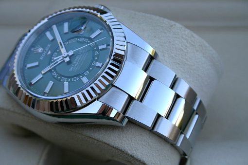 IMG_7230 | SD Watches Close-up of a stainless steel Rolex watch with a fluted bezel, blue dial, and magnified date window.