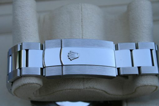 IMG_7232 | SD Watches Close-up of a stainless steel Rolex Oyster bracelet clasp with the crown logo visible on the center link.