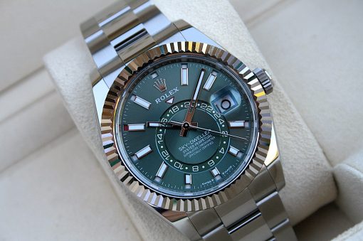 IMG_7241 | SD Watches Close-up of a green Rolex Sky-Dweller wristwatch with a fluted bezel and metal bracelet.