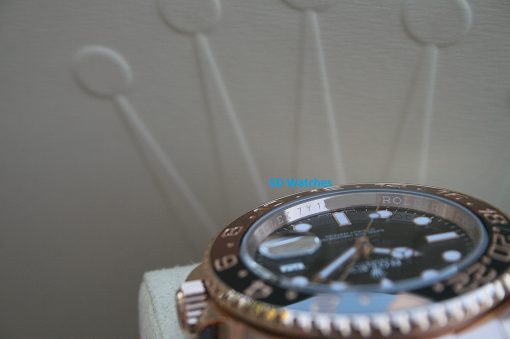 IMG_7269 | SD Watches Close-up of a rose-gold Rolex watch on a light cushion, with a blue 'SD Watches' watermark across the dial area