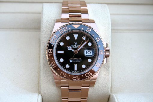 IMG_7277 | SD Watches Rose gold Rolex GMT-Master II wristwatch on a light beige display cushion, close-up view