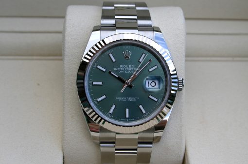 IMG_7296 | SD Watches Rolex Oyster Perpetual Datejust watch with a green dial and fluted bezel on a display cushion, stainless steel bracelet visible