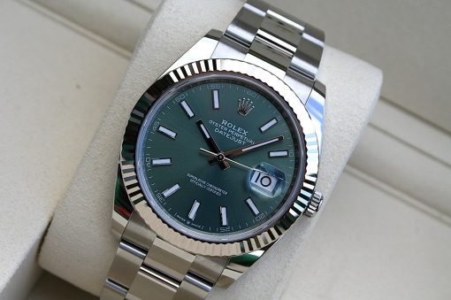 IMG_7299 | SD Watches Rolex Datejust with a green dial, fluted bezel, and stainless steel bracelet; date window with magnifier at 3 o'clock.