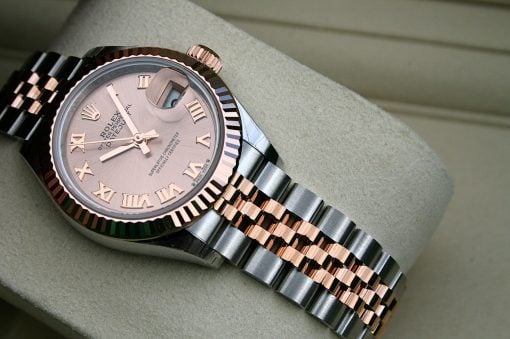 IMG_7303 | SD Watches Rose gold and steel Rolex watch with pink dial, Roman numerals, date window, and fluted bezel.