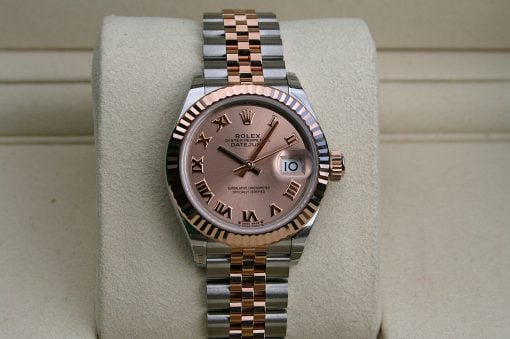 IMG_7314 | SD Watches Rolex two-tone wristwatch with pink dial and Roman numerals on a beige display cushion