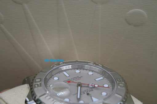 IMG_7327 | SD Watches Close-up of a silver Rolex watch showing its dial and bezel, resting on a beige surface with blue 'SD Watches' text visible.