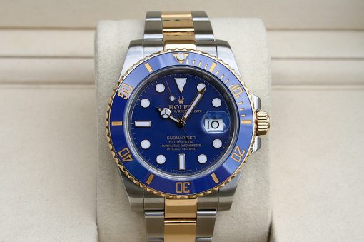 IMG_7351 | SD Watches Two-tone Rolex Submariner with blue dial and blue bezel on a beige display cushion.