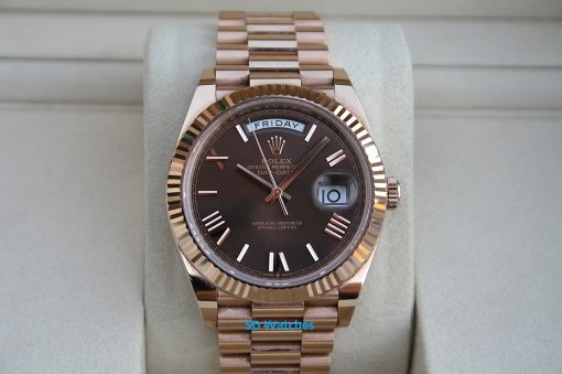 Rolex 228235 | SD Watches Rose gold Rolex Day-Date watch on a padded display cushion with day and date windows visible (Friday, 10).