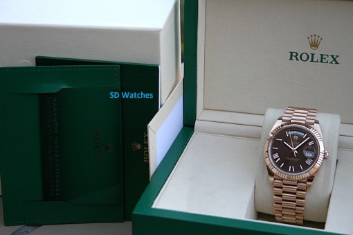 IMG_7364 | SD Watches Rolex watch in an open green presentation box, showing a rose-gold bracelet and black dial.