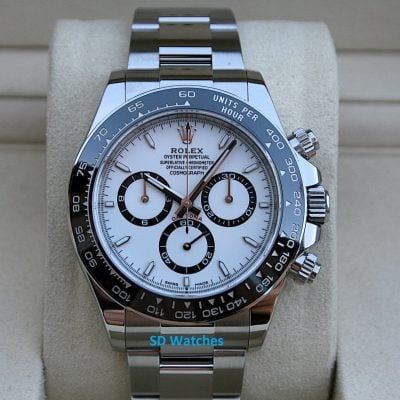 Rolex Cosmograph Daytona with white dial, black subdials, and stainless steel bracelet on display.