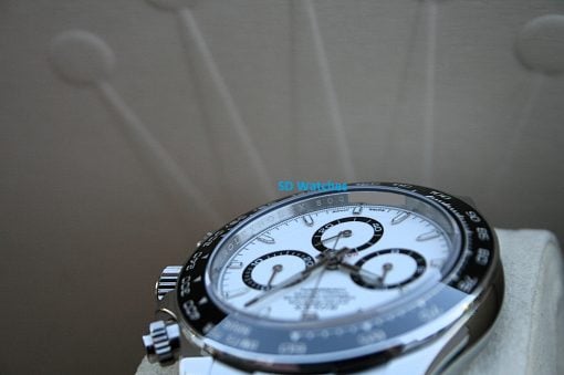 IMG_7380 | SD Watches Close-up of a silver chronograph wristwatch with white dial and black tachymeter bezel, on a wrist, with blue 'SD Watches' text overlay.
