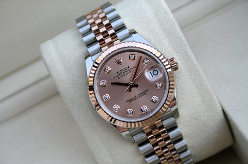 IMG_7425 | SD Watches Rose gold Rolex watch with diamond hour markers and a two-tone bracelet on a light cushion display area