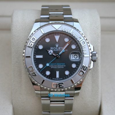 Rolex 268622 | SD Watches Rolex Yacht‑Master stainless steel watch on a beige cushion with a black dial and date window at 3 o'clock.