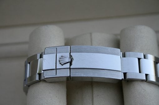IMG_7450 | SD Watches Close-up of a silver Rolex Oyster watch bracelet, clasp visible with crown logo.