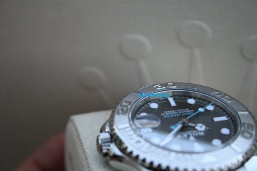 IMG_7457 | SD Watches Close-up of a stainless steel wristwatch resting on a light surface, with blue text 'SD Watches' across the dial.