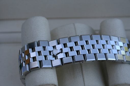 IMG_7491 | SD Watches Close-up of a silver metal watch bracelet draped around a foam display form, showing a Rolex-style clasp.