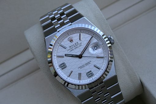 IMG_7495 | SD Watches Close-up of a silver Rolex wristwatch with a fluted bezel, date window at 3, and a polished metal bracelet.