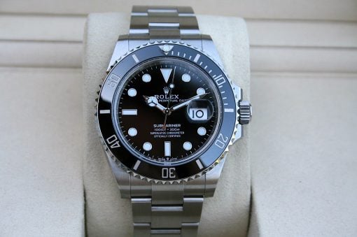 IMG_7517 | SD Watches Close-up of a stainless Rolex Submariner on a padded display, black dial with date at 3, and a rotating bezel.